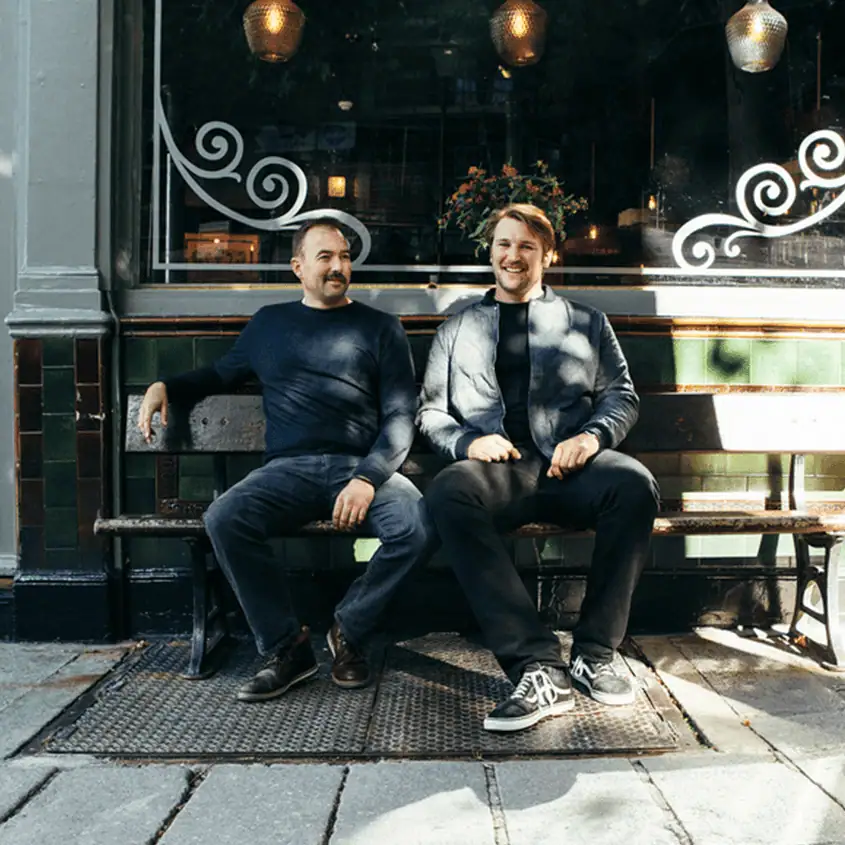 two persons sitting on the bench